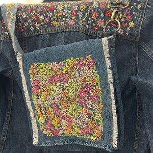 Hand Embroidered crossbody bag. Handmade from recycled Levi’s Floral lining